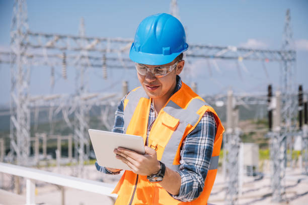 istock Young engineer man looking and checking electric power station 966310662
