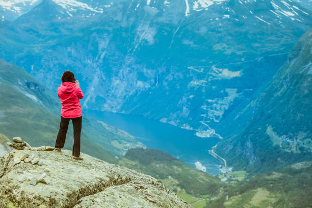 istock Tourist taking photo from Dalsnibba viewpoint Norway 966310728