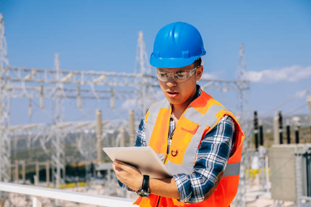 istock Young engineer man looking and checking electric power station 966311126