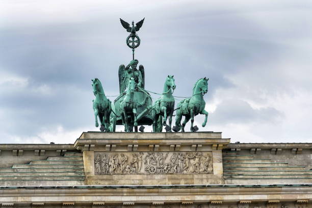 istock Quadriga on Brandenburg Gate, dramatic cloudy sky background, Berlin, Germany 966313556
