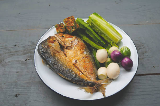 Fried mackerel with shrimp paste sauce and vegetable set. Thai food stock photo