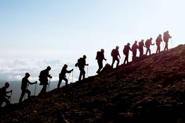 mountaineering group silhouette stock photo