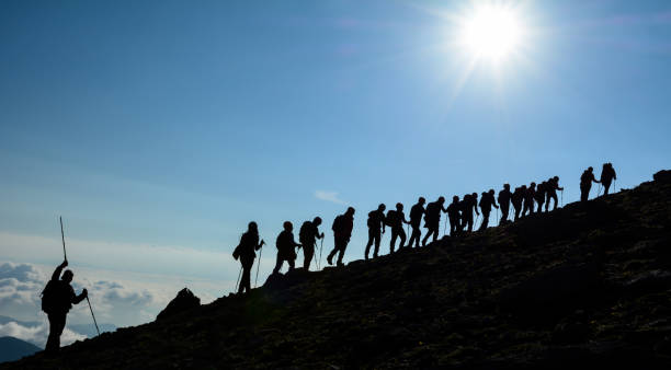 istock successful, determined and challenging professional mountaineer group 966318336