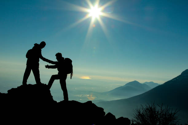 istock mountaineering, friendship, sharing together 966318998