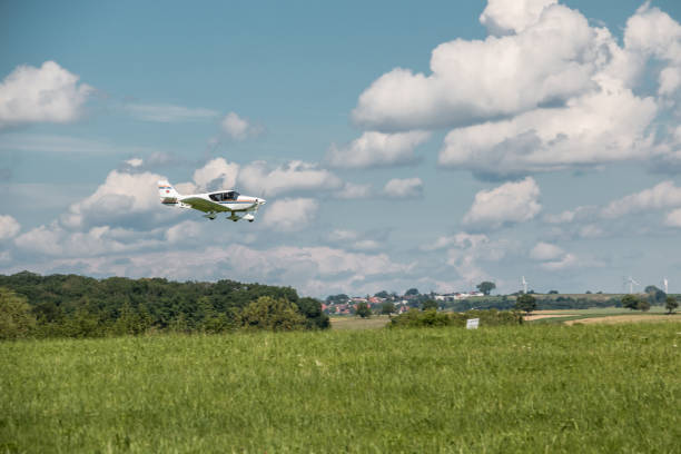 istock Little plane approaching and the green german countryside 966322978