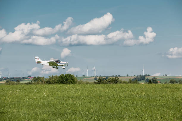 istock Little plane approaching and the green german countryside 966323130