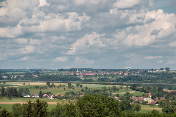 istock Little plane approaching and the green german countryside 966323866