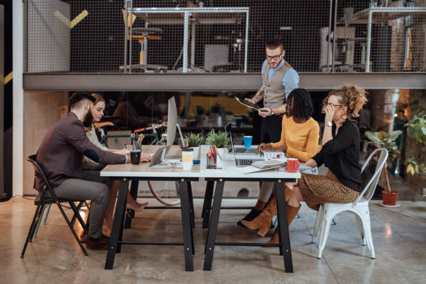 istock Group of creative people working in a modern office 966323952