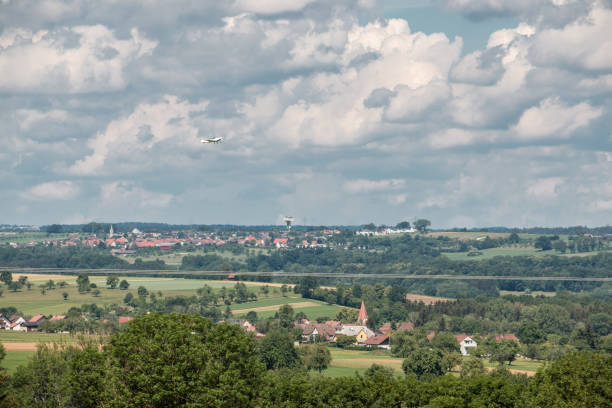istock Little plane approaching and the green german countryside 966324000