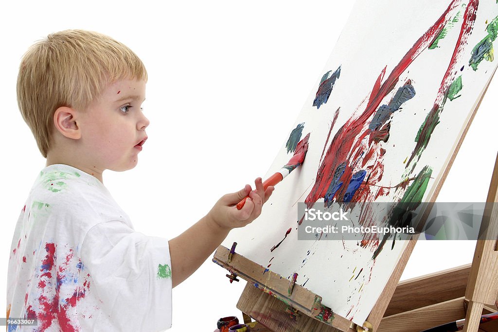 Adorable Boy Painting At Easel  Art Class Stock Photo