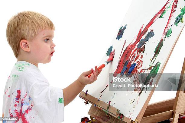 Adorable Boy Painting At Easel Stock Photo - Download Image Now - Art Class, Artist, Artist's Canvas