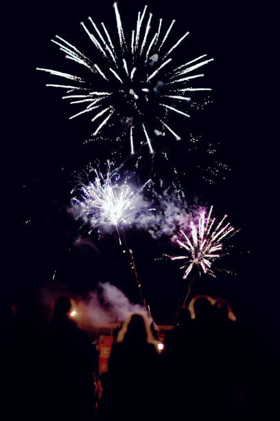 istock people look at the fireworks in the sky 966331708