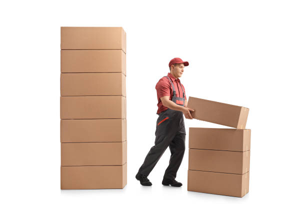 istock Mover placing a package on top of a stack of packages 966331986