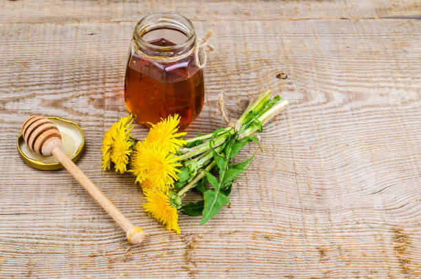 istock Fresh sweet transparent honey from dandelions, herbal tea 966334312