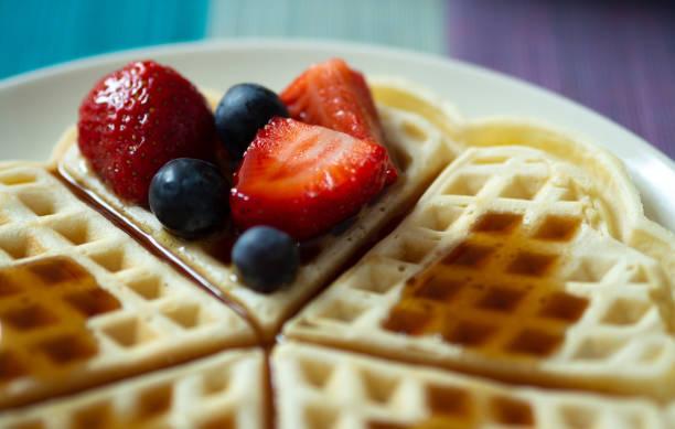 istock Waffle with strawberries, blueberries and syrup on a plate 966334706