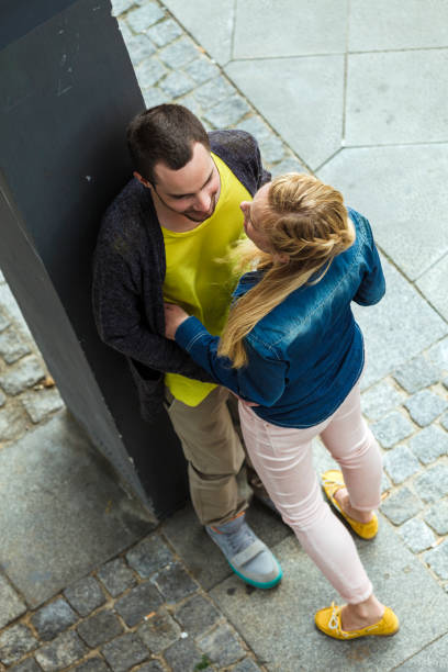 istock Young Couple Flirting In Urban Scenery 966335640