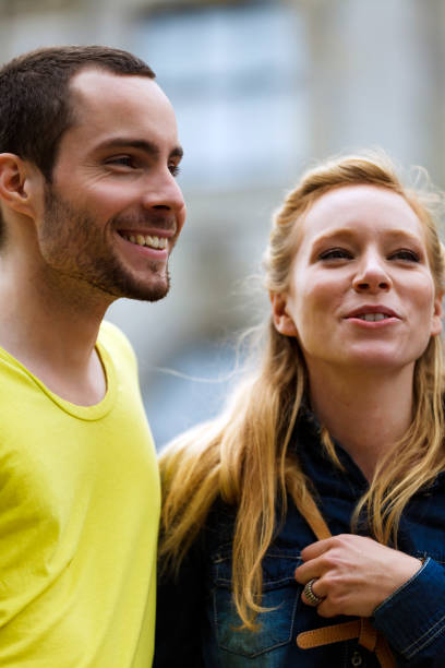 istock Young Couple Meeting With Friends 966335856