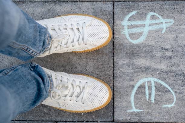 istock Female chooses euro or dollar signs. 966336166