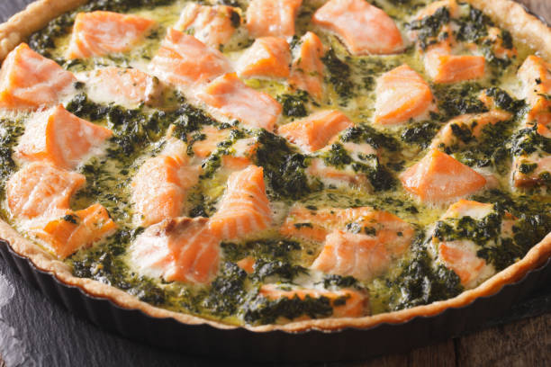 istock Healthy Savory quiche with salmon and spinach in dish macro. horizontal 966338384
