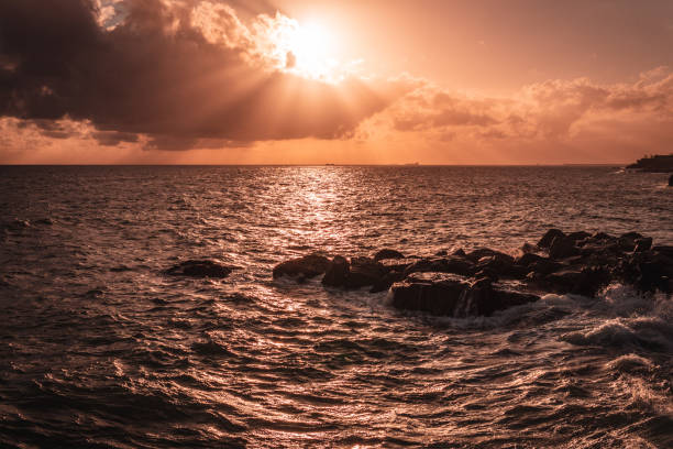 istock Sunset by the sea 966339218