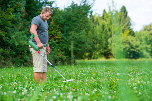 istock Man with a metal detector 966342956