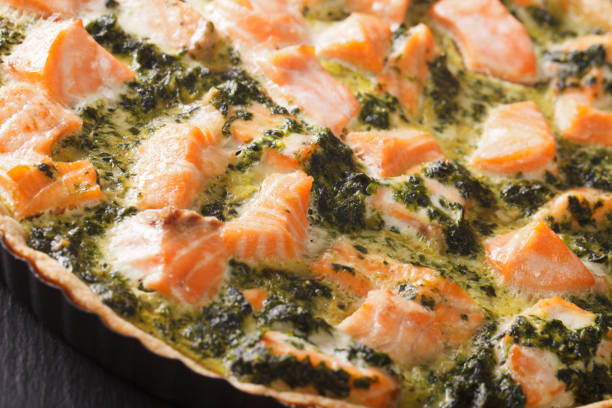 istock Freshly baked Savory quiche with salmon and spinach macro. horizontal 966345604