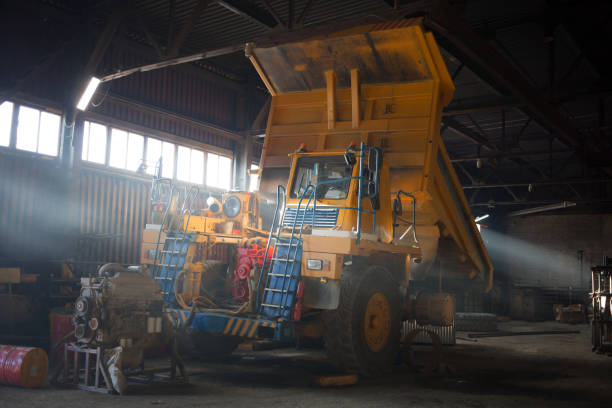 Yellow quarry dump truck in service zone
