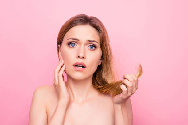 Minerals vitamins lack hand hold dry correction color natural mirror bathroom concept. Close up portrait of sad upset stressed beautiful lady holding split ends isolated background copy-space Minerals vitamins lack hand hold dry correction color natural mirror bathroom concept. Close up portrait of sad upset stressed beautiful lady holding split ends isolated background copy-space thin stock pictures, royalty-free photos & images