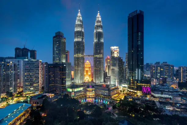 View towards the iconic Petronas Towers in downtown Kuala Lumpur at Night from above. Kuala Lumpur, Malaysia