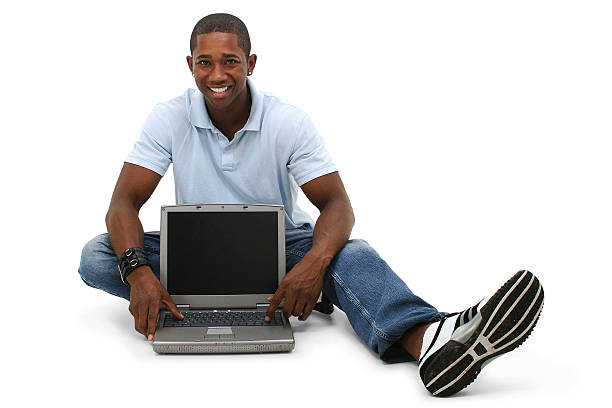 istock Attractive Young Man Sitting On Floor with Laptop Computer 96637258