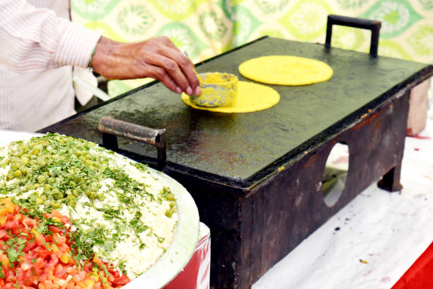 preparing besan cheela, Indian food in wedding