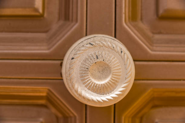 close up on a round door handle with decorative elements, door decoration, vintage