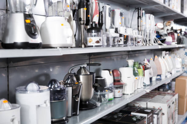 Image of different kitchen blenders and juicers at store