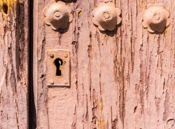 close up on the old lock with an interesting texture on the door, home security, vintage