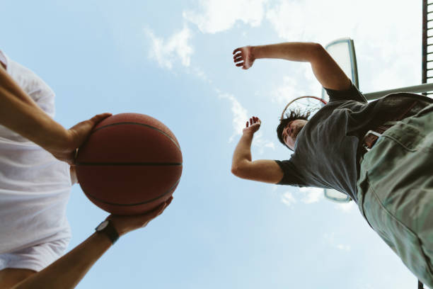 istock Two young Japanese men playing basketball 966376176
