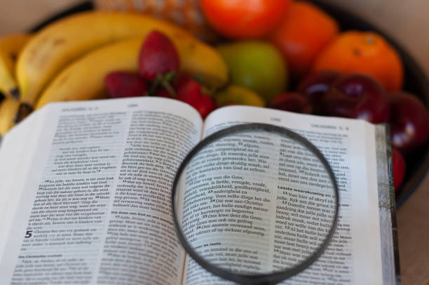 istock fruit bowl with bible and magnifying glass 966379676
