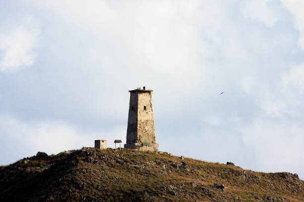 istock Low Angle View Of Lighthouse By Building Against Sky 966379780