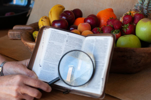 istock fruit bowl with bible and magnifying glass 966380008