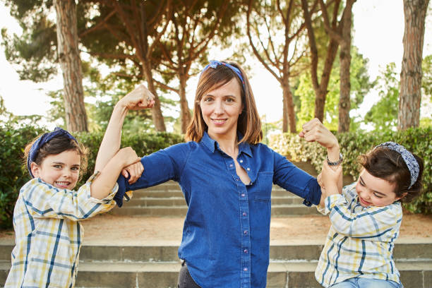 Strong mom flexing her arms - Girl power