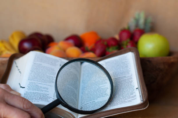 istock fruit bowl with bible and magnifying glass 966380222