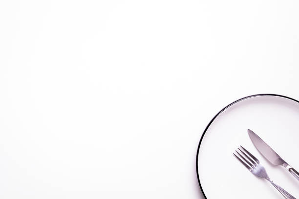 istock Top View Setting of Isolated Empty White Plate and Cutlery on a White Background 966381154