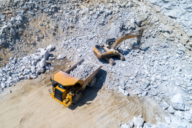 istock Truck and bulldozer working in the stone mine 966381606