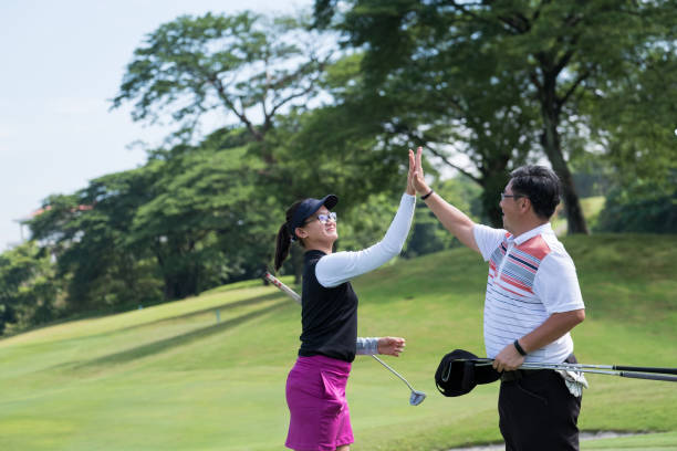 istock High 5 after that game of golf 966388808