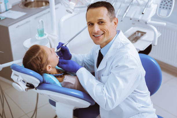 istock Joyful dentist being at his workplace 966391084