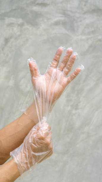 istock Men wear a glove on a gray background. 966394024