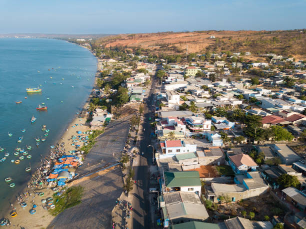 Top view, aerial view fishing harbour market from drone Top view, aerial view fishing harbour market from drone. Royalty high quality free stock image of market at Mui Ne fishing harbour or fishing village. Fishing harbor is a popular tourist destination mui ne bay photos stock pictures, royalty-free photos & images