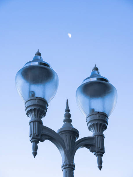 istock Lamppost in the foreground with the moon in the background 966394718