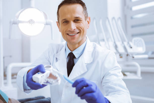istock Joyful stomatologist being at workplace 966395988