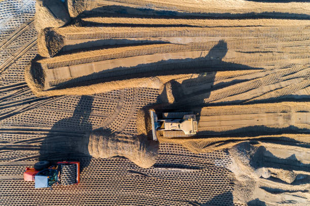 istock Roller and bulldozer on the new road under construction 966396102