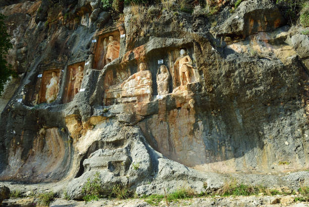 istock Adamkayalar - rock carved figures. Turkey 966400290